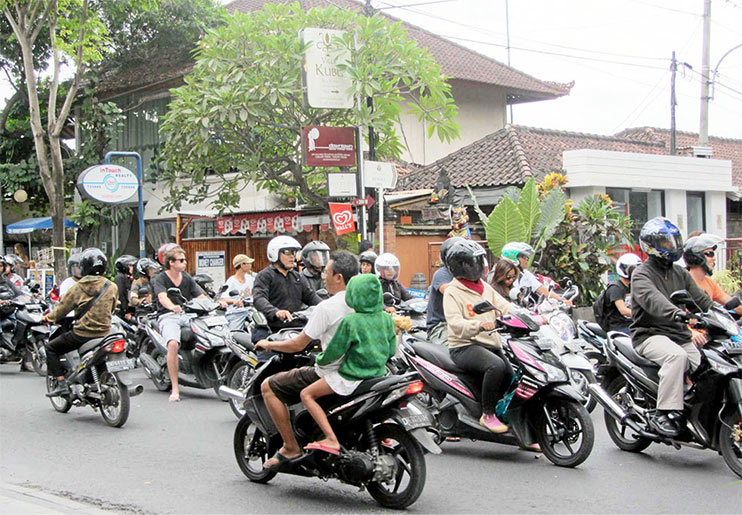 City bike riding during rush hour