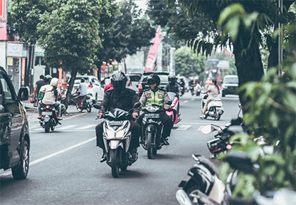 The police patrol the streets in the general traffic flow