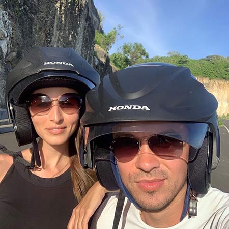 Paired photo of the driver and passenger of the bike in helmets